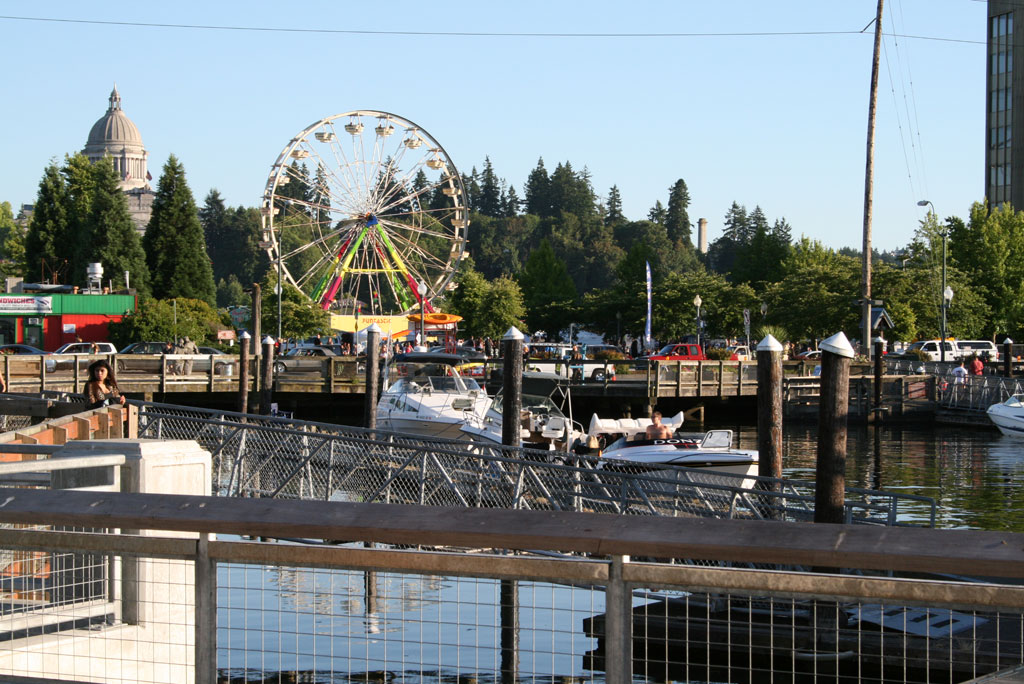 Capitol building overlooking Capital Lakefair downtown Olympia with motor boats and yachts 